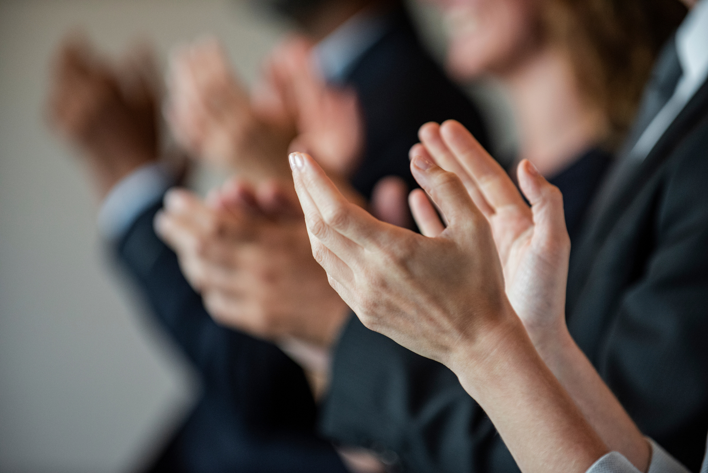 Businesswoman clapping hands