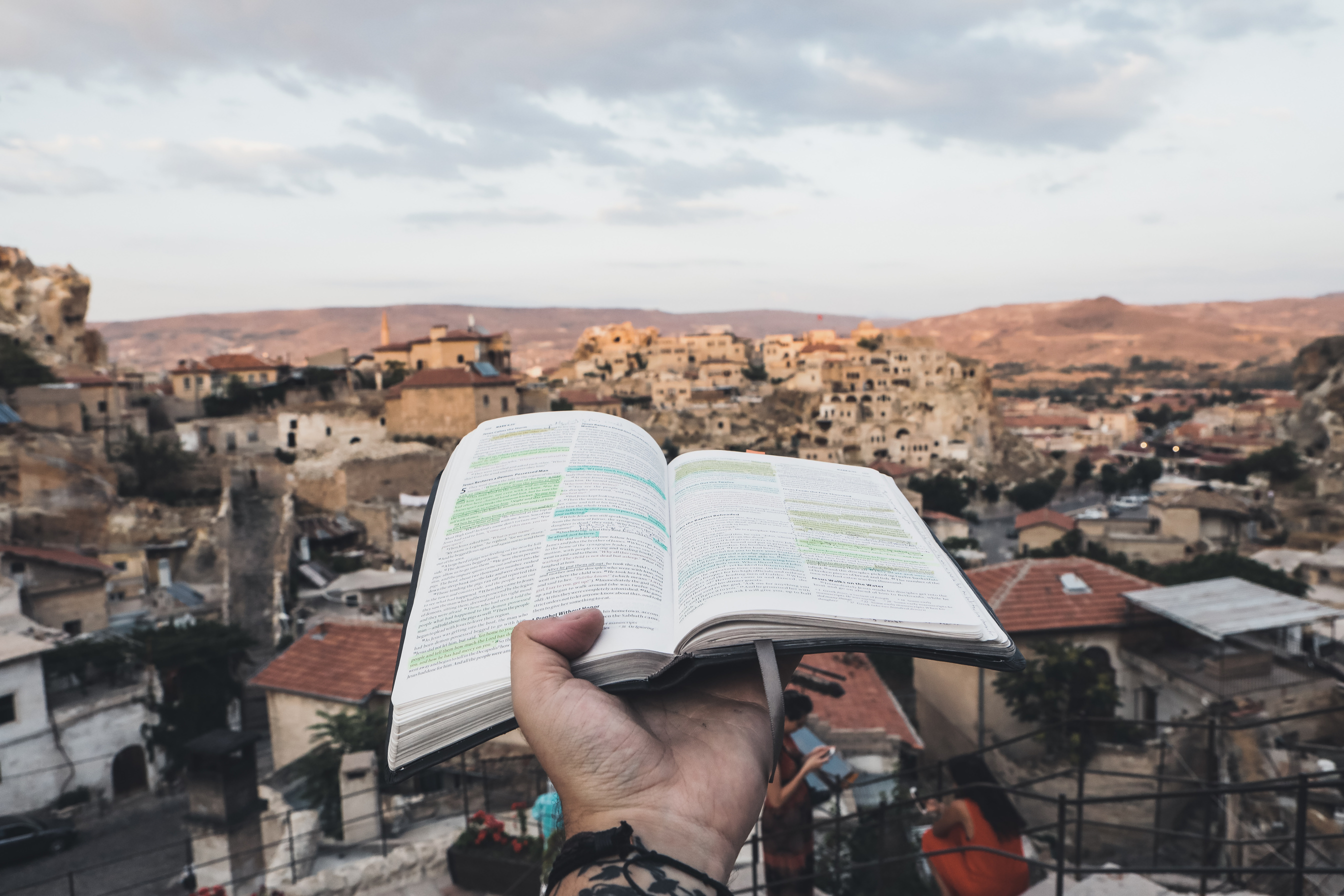 A Person Holding a Bible